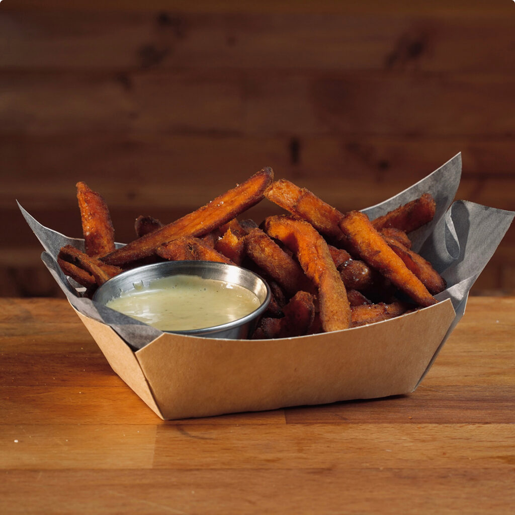 Boniato dulce frito con salsa en Madrid